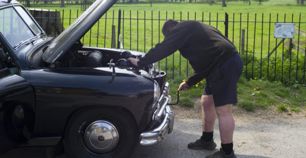 Mechanic Repairing Car