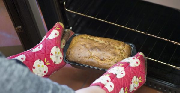 Person Taking Cake Out Of the Oven