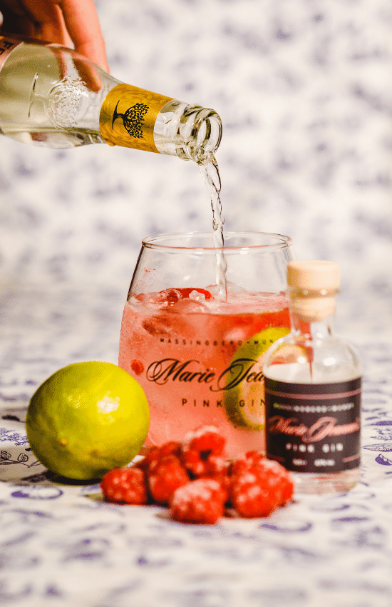 Gin and tonic in branded glass