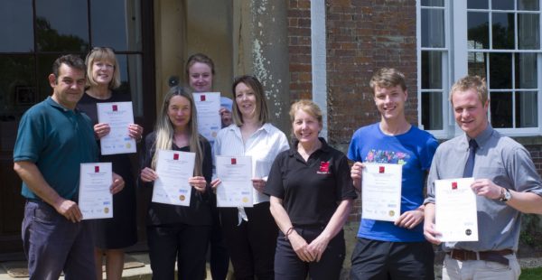 People Holding Certificates