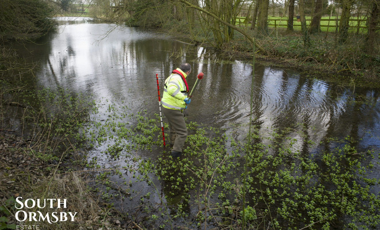 Man Testing Lake Silt